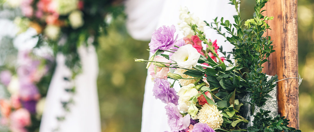 An image to show artificial flowers decorating a wedding venue.